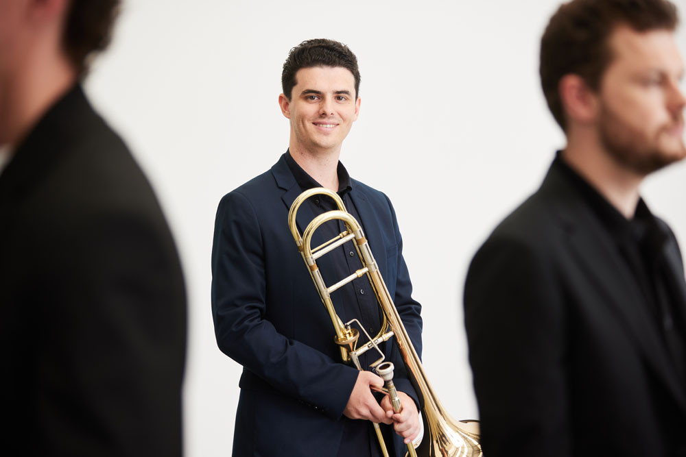 Mt Sheridan trombonist Jordan Mattinson, 23, has become one of the 13 musicians selected for the Sydney Symphonic Orchestra fellowship. Picture: Daniel Boud