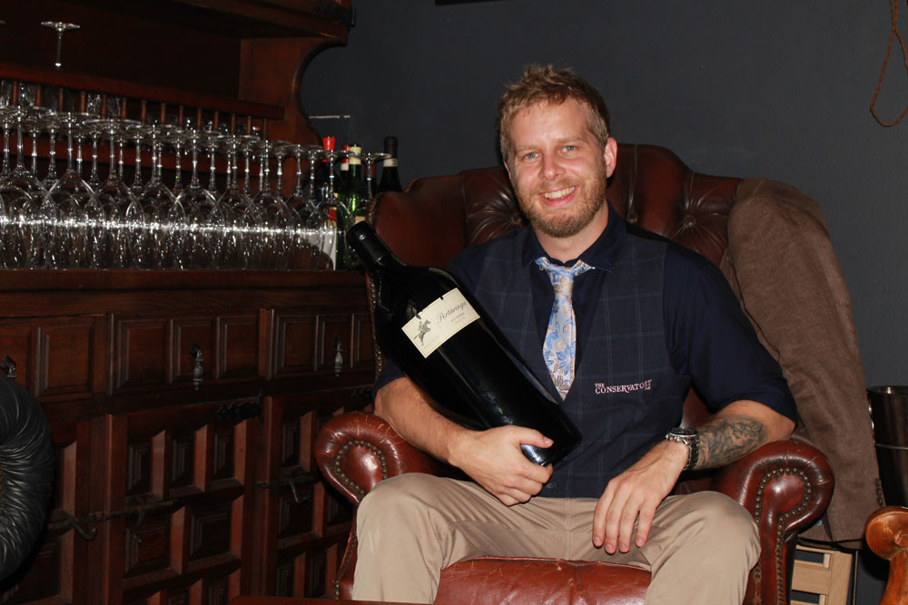 Ross Stevens of The Conservatory Bar loves to share his love and knowledge of fine wines with his guests. Picture: Isabella Guzman Gonzalez