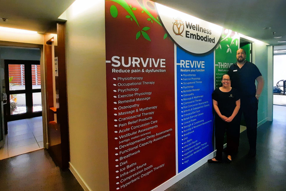 Danielle Erskine and Adam Maher outside the new Abbott St Wellness Embodied Clinic. Picture: Alamando Anton