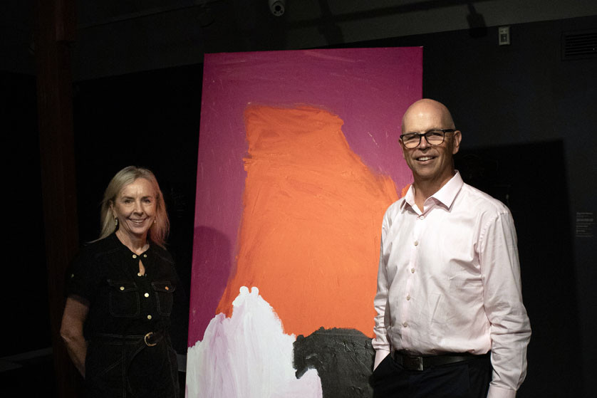 Sarah Mort and Richard Barker standing in front of Mirdidingkingathi Juwarnda by Sally Gabori, Dibirdibi Country 2009. Picture: Cairns Art Gallery