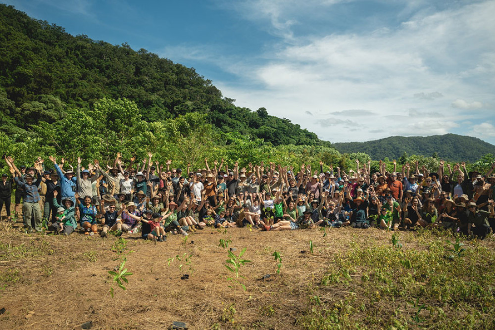 Dozens of volunteers celebrate the planting of hundreds of trees in the Daintree rainforest. Picture: Rainforest Rescue