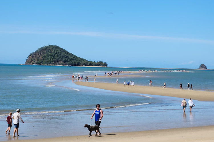 A really low tide on August 19 allowed many people to walk across the floor of the Coral Sea, almost to Double Island. Picture: Ross Palm