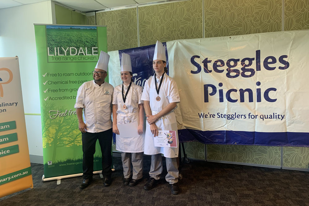 Chef Brandon Felix (left) with St Andrew’s College hospitality students Annika Reiha and James Ryan after winning the FNQ Regional Secondary Culinary Competition. Picture: Barbara Ryan