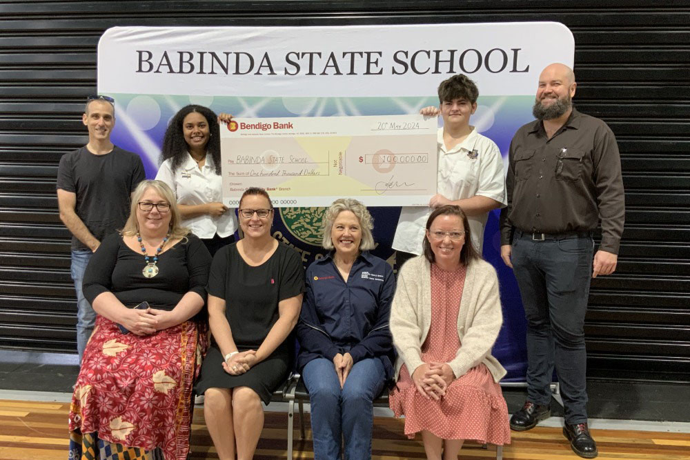 (Back, from left) Community Bank Babinda board member Stu Lawson, Babinda P-12 State School 2024 school captains Adah and Finlay, principal Rob O’Brien, (front, from left) bank representatives Tanya Tuttle, Hayley Powell, Kitty Anning, and Kristy Gilvear.