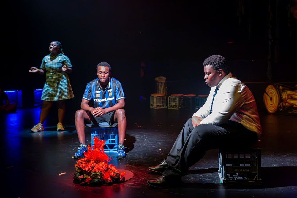 Kabili (Jacques Alphones) tells Emmanuel (Pacifique Mukunzi) a story. Picture: Supplied
