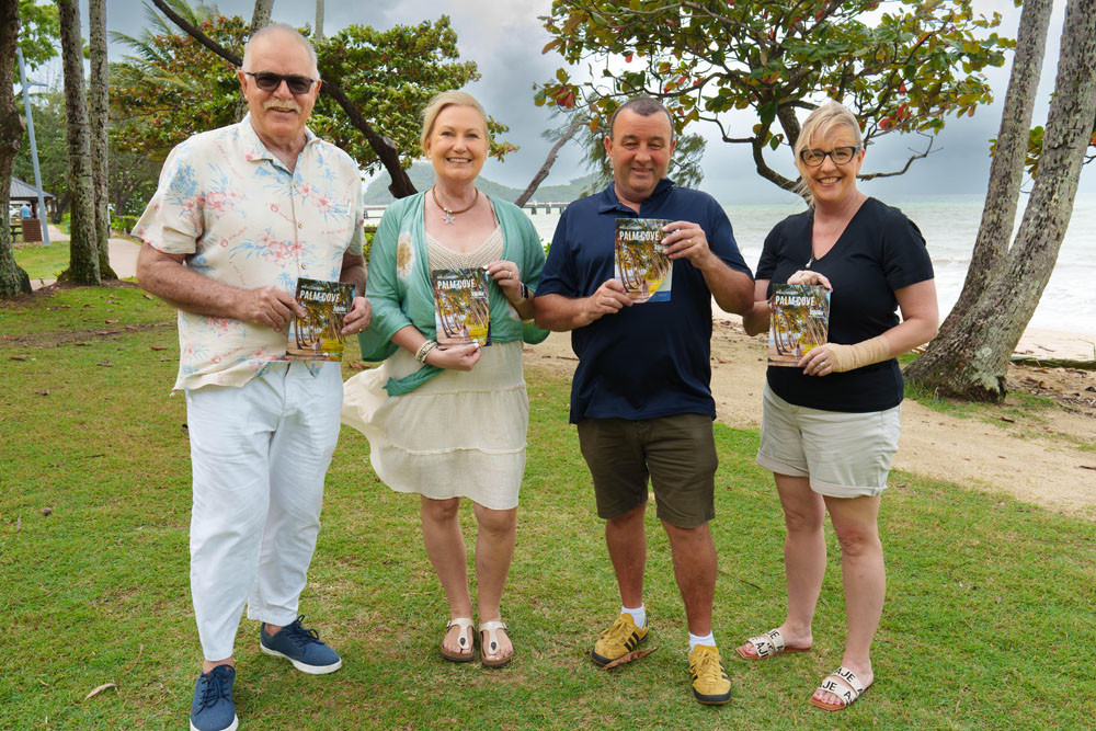 Daryl O’Reilly, (left), Melissa Dixon, Mark Byron and Stacie Hosking of Advance Palm Cove with the new guide. Picture: Colin Pett/ MOD Films and Photos