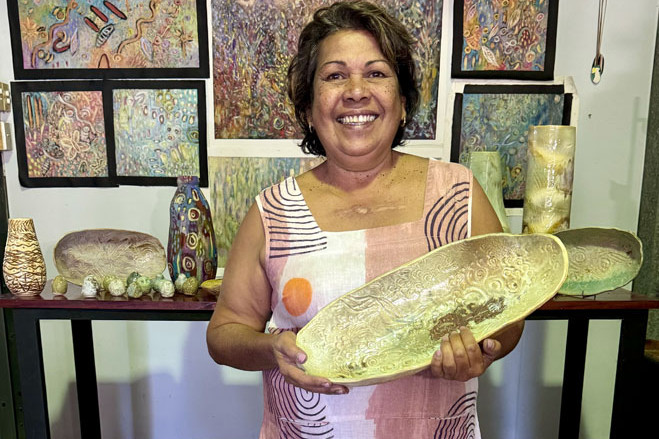Cairns artist Susan Reys with her ceramics at the CIAF’s art markets. Picture: Supplied
