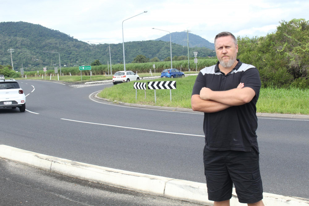 Cr Brett Olds at the Holloways Beach roundabout