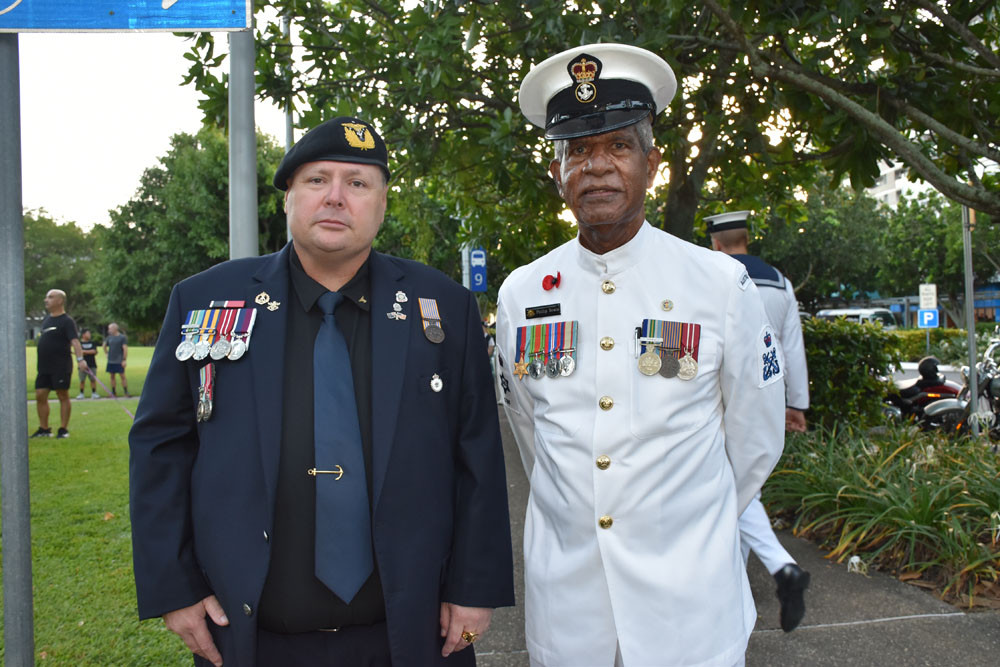 Coastguard officer James Williams, of Earlville, and Torres Strait Islander navy veteran Phillip Bowie, of Edmonton, at the Cairns Cenotaph. Picture: Isabella Guzman Gonzalez