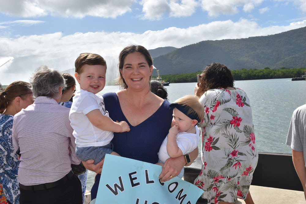 Jessica Littlewood with her children Ruby and Jack welcoming partner Darren, who arrived back on HMAS Melville.