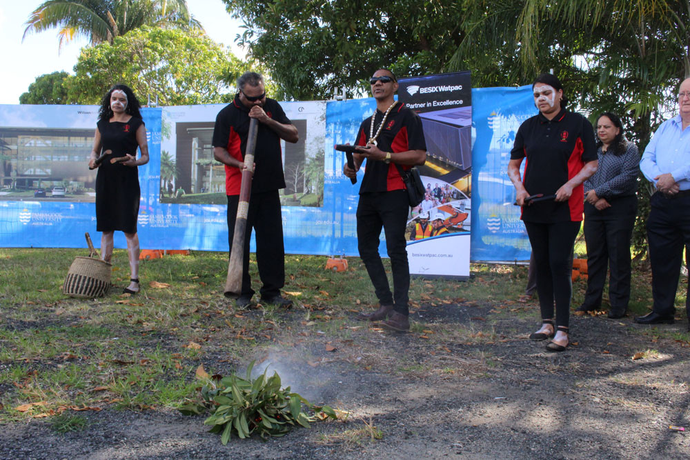 Yidinji members (from left) Maria Morrison, Shaun Creek, Marun Fourmile and Iesha Bong perform the smoking ceremony.