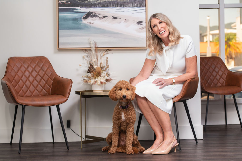 Cairns lawyer Beth Rolton with Charlie, the therapy ‘groodle’. Picture: Blueclick Photography