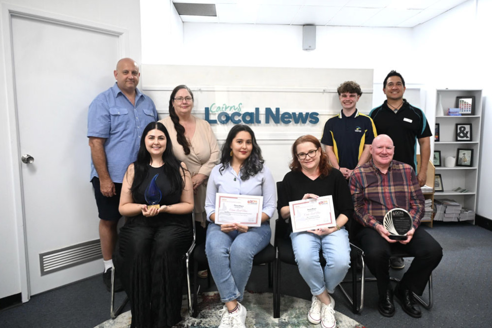Cairns Local News staff (from left, back row) David Galeano (sales), Kath Maclean (manager), Isaac Colman (editorial), Almando Anton (sales), (front) Maddy Gavin (digital content), Isabella Guzman Gonzalez (editorial), Lisa Harris (administration) and Nick Dalton (editor) with the awards.