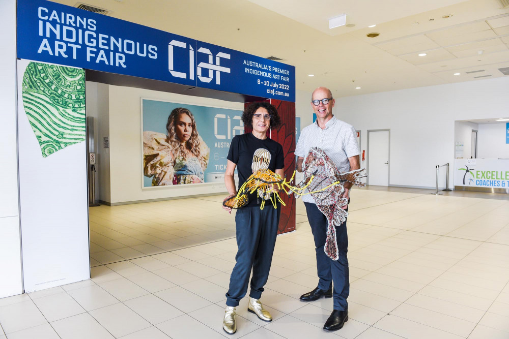 CIAF Artistic Director Janina Harding with Cairns Airport CEO Richard Barker celebrate renewed partnership. Photo by Blueclick Photography.