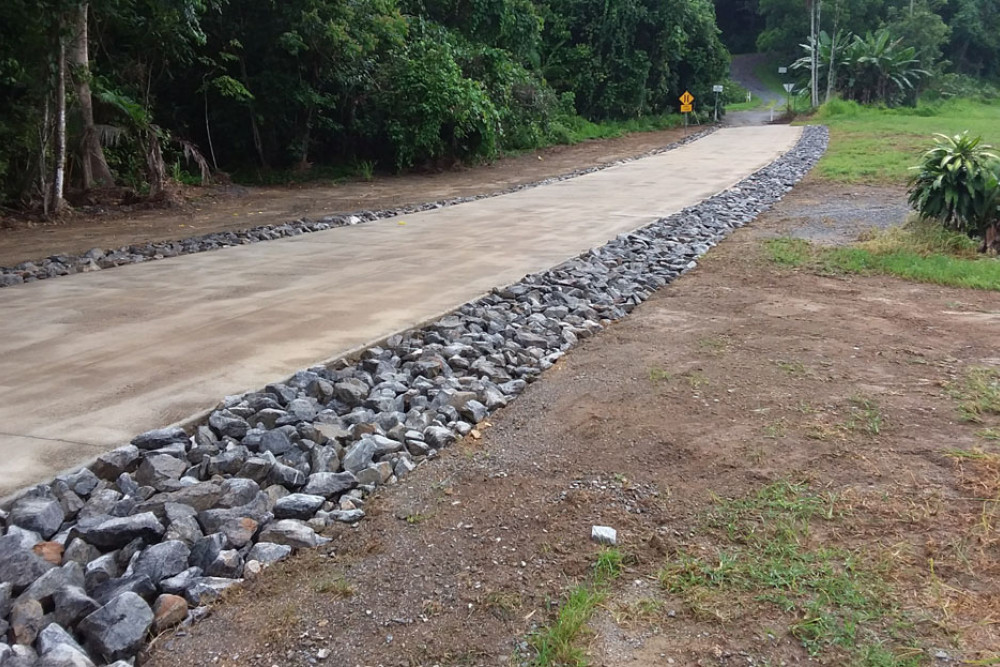 Three rural unsealed roads will be turned into concrete pavements later this year. Poletti Road at Miallo recieved floodway improvements late last year