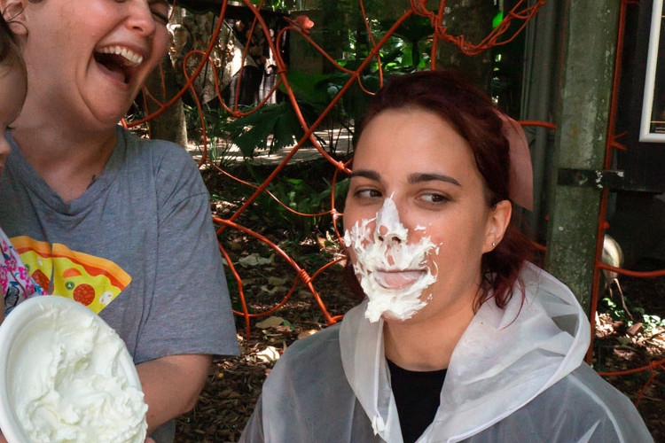 Cairns Children’s Museum general manager Ori Shepherd gets a pie face from Kirsty Bate. Picture: Supplied