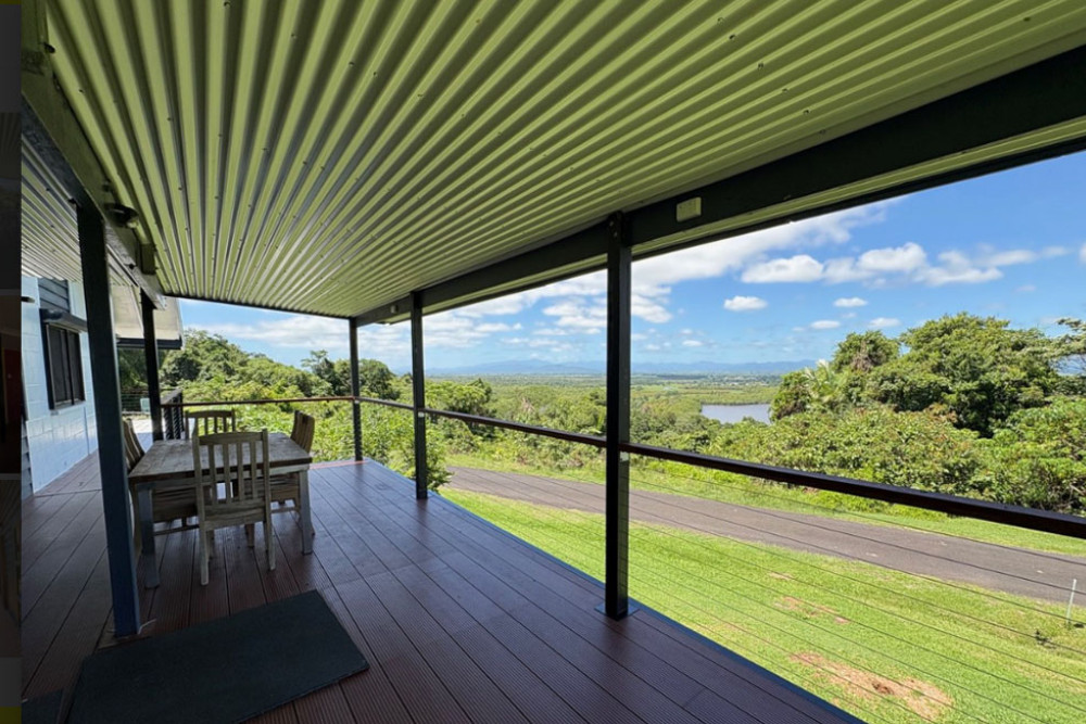 Stunning views can be seen from the deck of this Coquette Point house at Innisfail. Pictures: Supplied