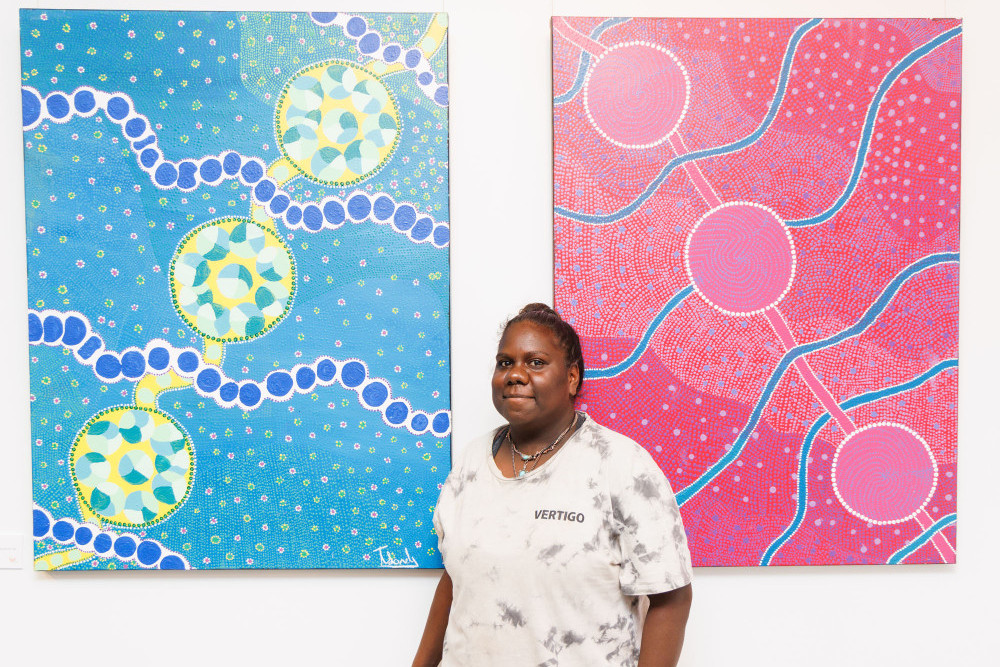 Tamisha Sandy of Doomadgee with her artworks from the Water Dreaming series. Pictures: Colyn Huber, Lovegreen Photography.