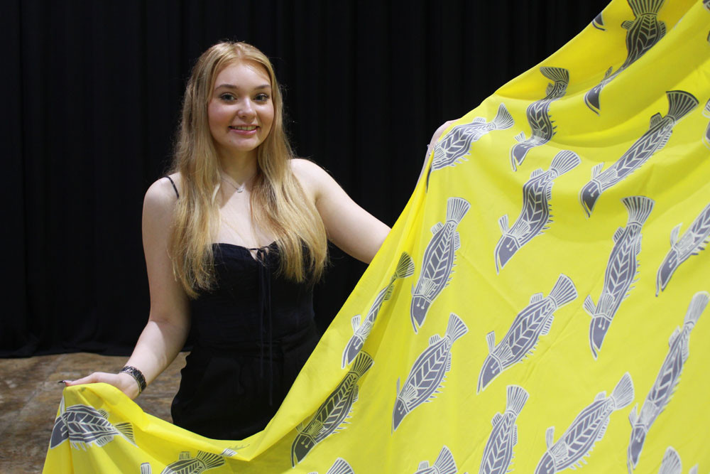 First time Cairns Indigenous Art Fair designer Holly McInnes with her woven piece called Guyu lemon and rice. Picture Isabella Guzman Gonzalez