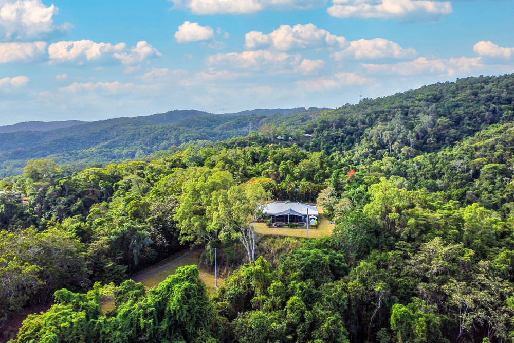 The hilltop property has stunning views overlooking canefields, mountain ranges and the Coral Sea. Pictures: Supplied