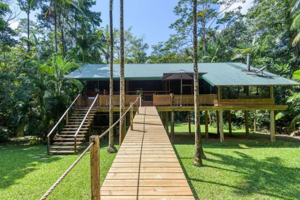 This Daintree treehouse has a private pontoon and a permit for fishing or croc tours. Picture: Raine and Horne