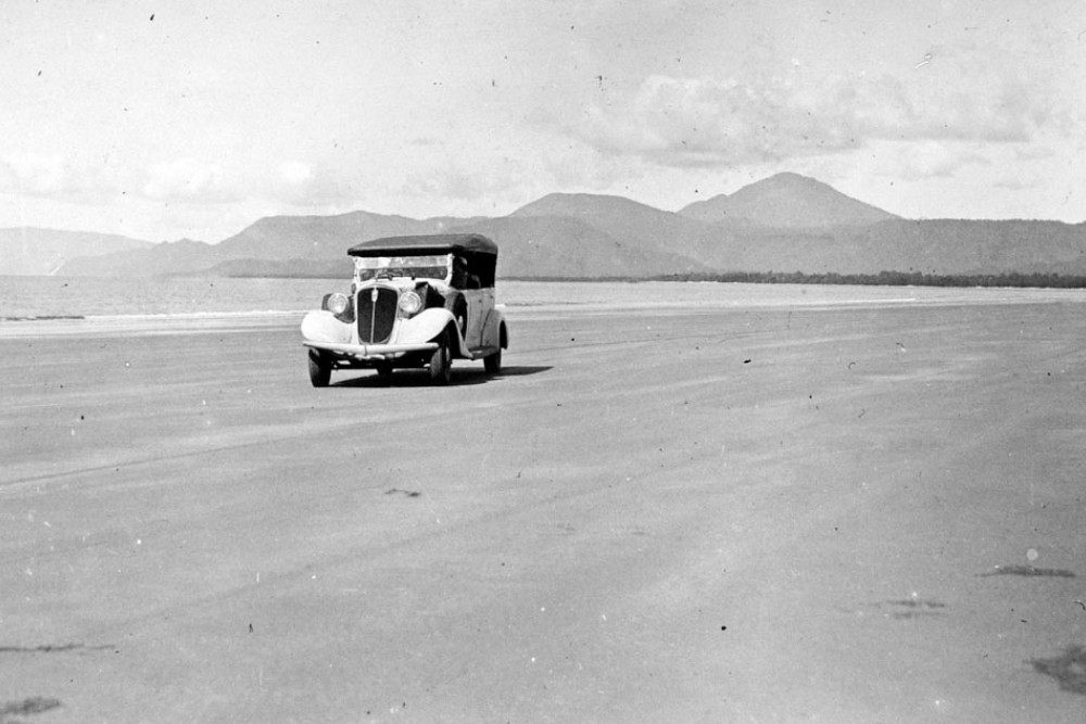 Motoring on the beach at Port Douglas, 1935. Courtesy Queensland Archives.