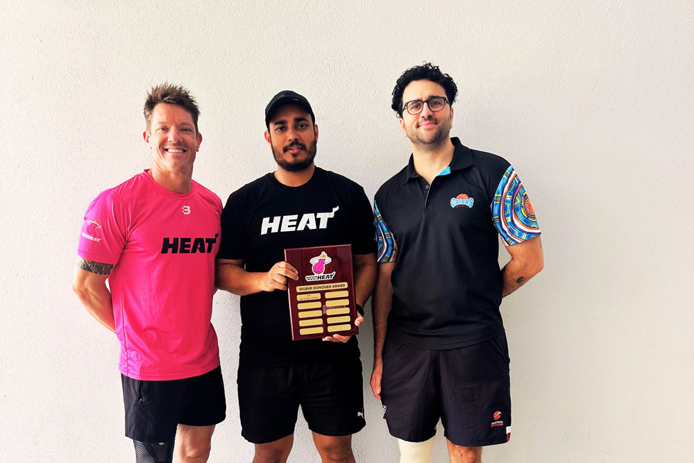 Northern Beaches Heat Basketball Club president Dave Thomas, club founder Wilbur Donovan and Cairns Basketball Inc. general manager Luca Vergari hold the prestigious Wilbur Donovan Award. Picture: Supplied