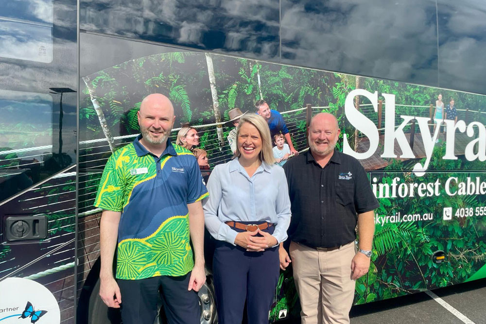 Skyrail’s Richard Berman-Hardman (left), Barron River MP Bree James and Colin Anderson of Tropic Wings with the new coach. Picture: Supplied