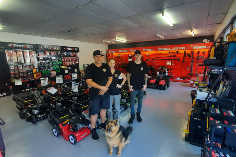 Steven and Sharni Green (owners), Conner Loneragan (apprentice mechanic) and pup Dakota at Freshwater Small Engines. Picture: Almando Anton