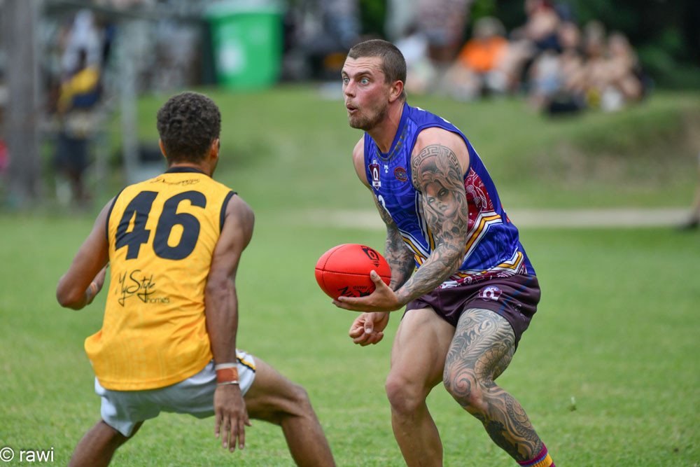 Tom Simpson (City Lions) looks to handball along his way to collecting 47 disposals against Tigers last weekend. Picture: rawi/AFL Cairns