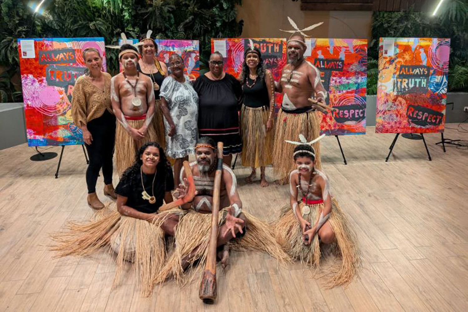 Some of the artists pose for a group photo on the opening night of 'Truth in Print' at Crystalbrook Bailey hotel. Picture: Supplied