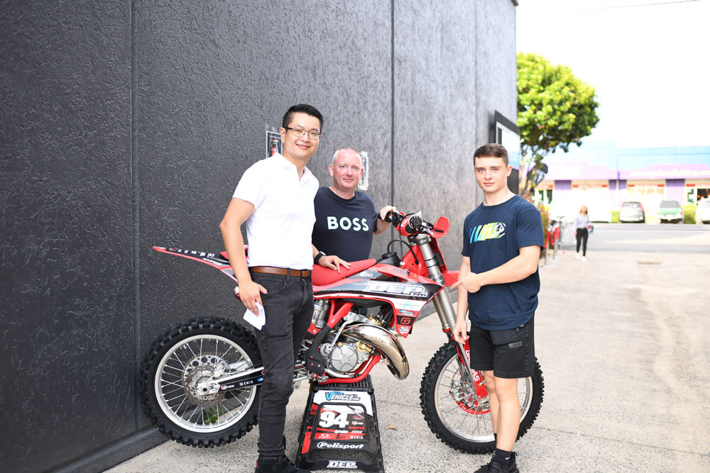 Alan Ren of Cairns Cars at the new Bikecraft premises with Mark Osborne and his son Alfie. Picture: Supplied