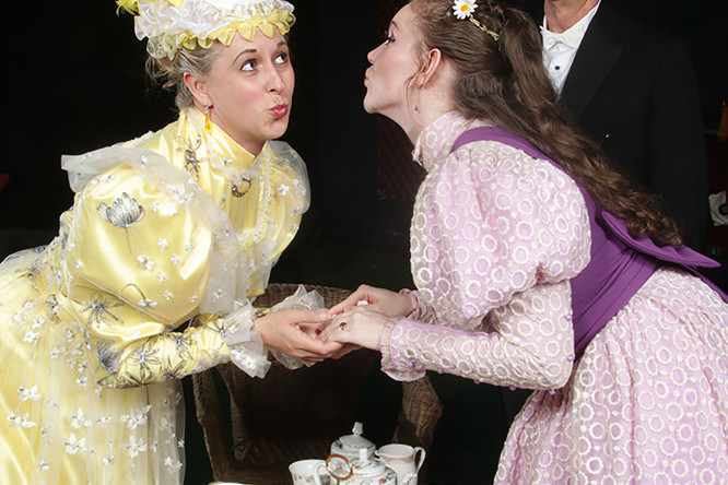 Heather Baker (Gwendolen), Alice Bosanquet (Cecily) and Paul Hynes (Merriman) in The Importance of Being Earnest. Picture: Paul Barton