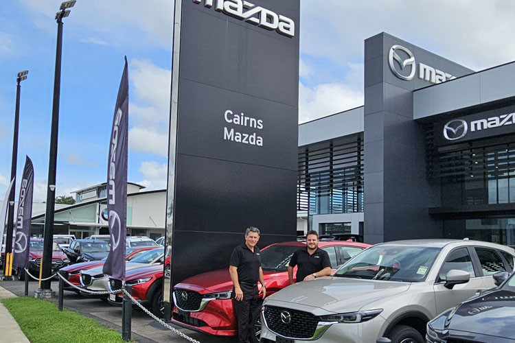 Cairns Mazda sales manager Darrell Callaghan and general manager Scott King with the new Cairns Mazda sign.