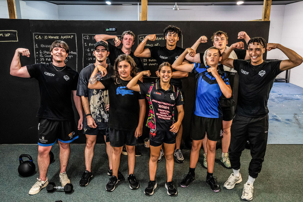 Phalanx Fitness members (from left) Dylan, Reuban, Brock, Tobias, Jack, Dallas, Holly and Rhee (surnames withheld) with owner Akon Ali. Above right: Members inside the new gym. Pictures: Supplied