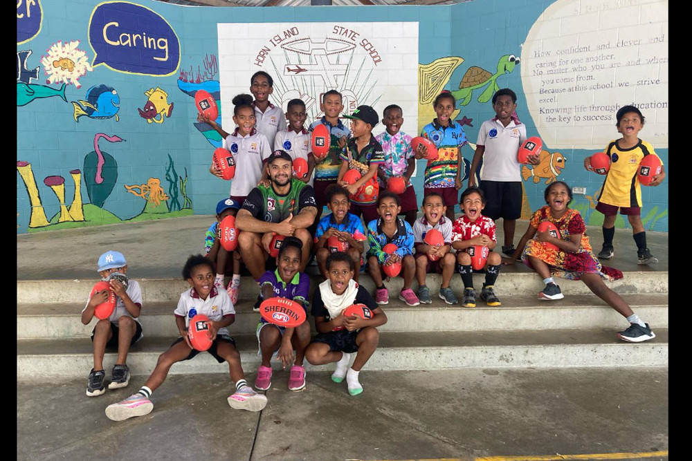 AFL Cape York Foundation cultural support officer Bernard Singleton jnr with children at Horn Island School. Picture: Supplied