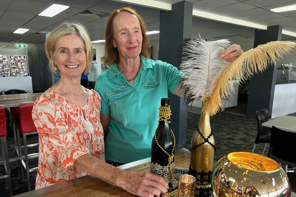 Centenary celebrations committee member Jen Wood (left) and centenary co-ordinator and women’s captain Jane Johannsen look forward to Cairns Golf Club’s 1920s themed cocktail party. Inset: The day after the Christmas Day fire. Pictures: Supplied