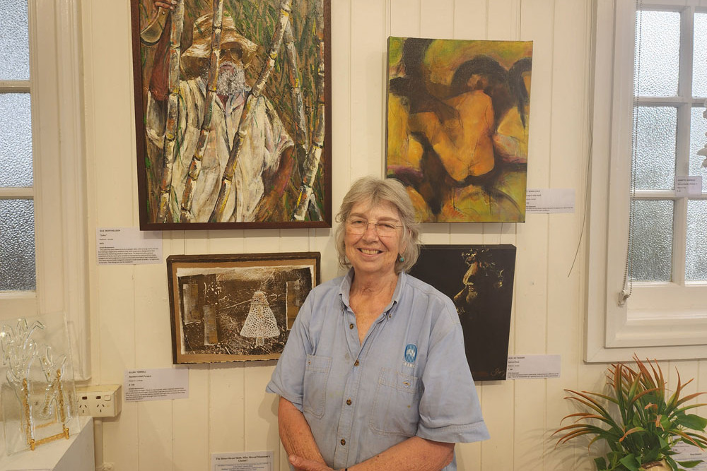 Sue Berthelsen, proudly displaying a painting of her late husband, John, at the latest DAB Art Exhibition. Picture: Gary ‘ Gazza’ McIlroy