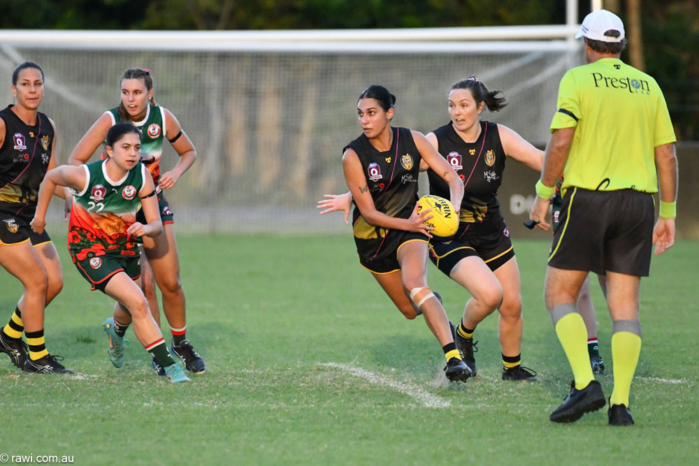 Mya Cozzoul (Tigers) breaks away from the Cutters in last weekend’s match. Picture: AFL Cairns