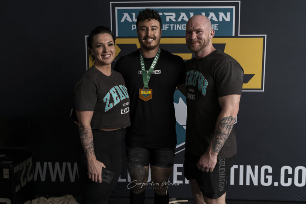 2024 Cairns Cup winner Sam Coelli (centre) with gym owners Brooke Vick and Wesley Vick. Picture: Supplied