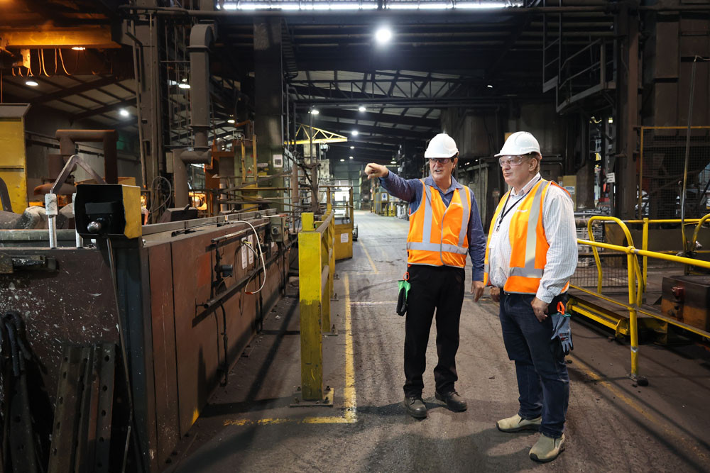 Foundry boss Joe Vecchio explains the waste issues to Hill MP Shane Knuth at the factory. Picture: Supplied.