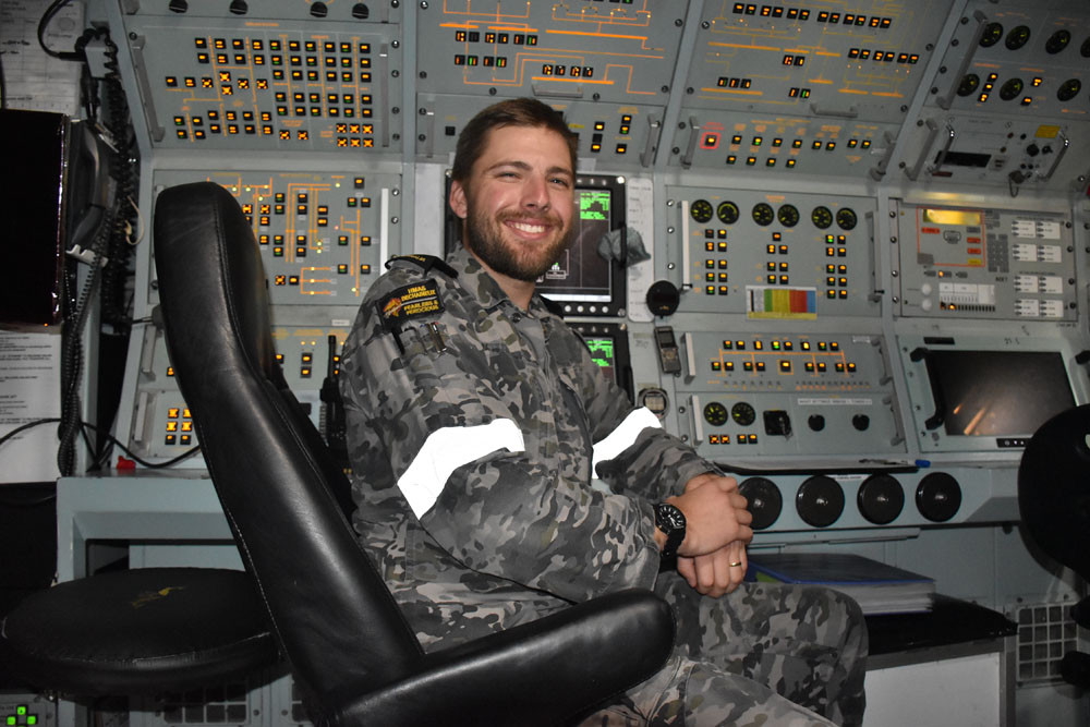 Leading seaman Sam (surname withheld) in the control room of the submarine.