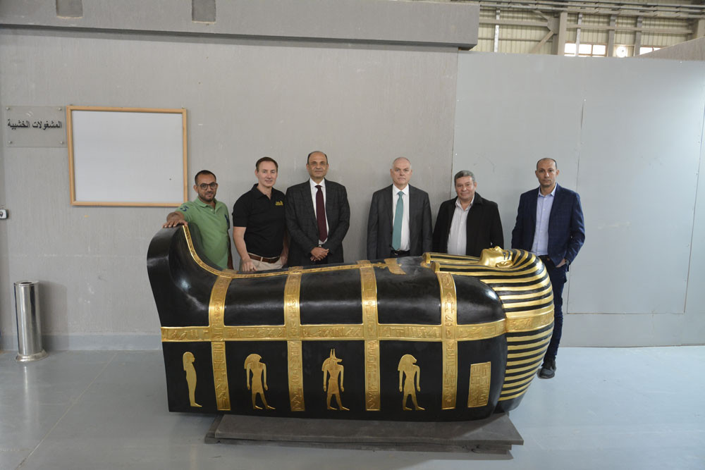 Inspecting the enormous gilded wood outer coffin of Yuya, the great grandfather of King Tut, are (from left) Konouz Australia sales manager Mounir Saad, Tomb of the Pharaohs CEO Daniel Leipnik, Konouz CEO Hisham Shaaraway, the Australian ambassador to Egypt Dr Axel Wabenhorst I, Ministry of Tourism and Antiquities egyptologist Dr Hani Ahmed Badr and Konouz sales director Shady Samir. Picture: Tomb of the Pharaohs