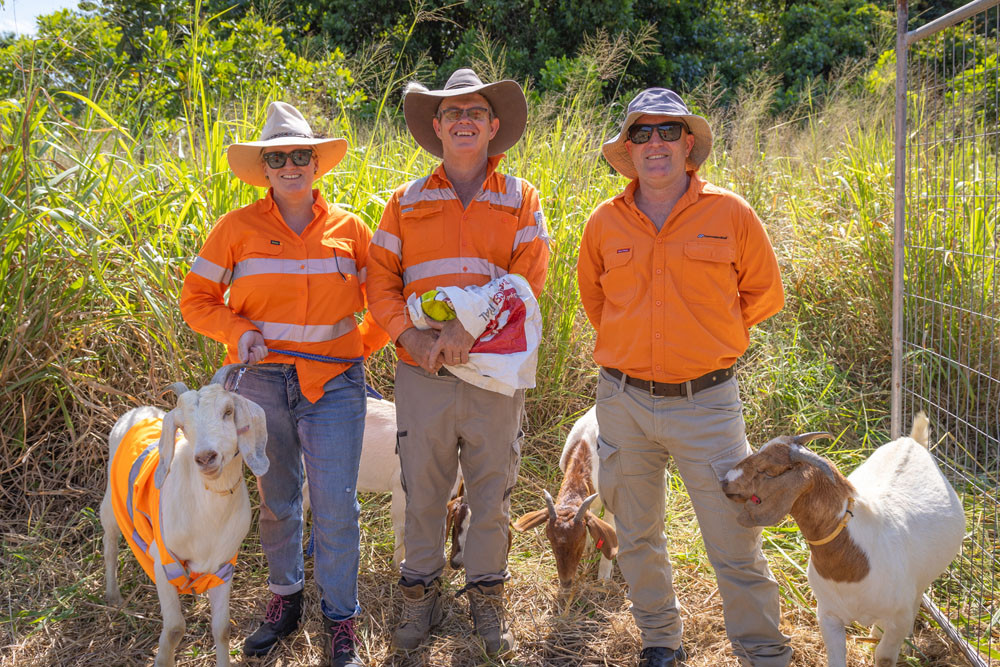 Christina Forrest, Scott Forrest and Glenn Withers with four of the goats at Tully railway station. Picture: Queensland Rail