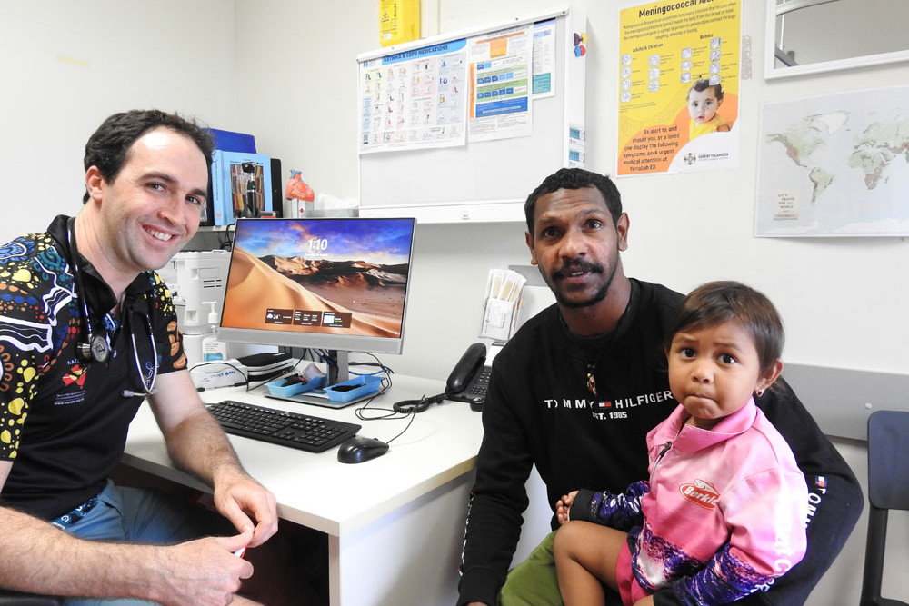 Dr Peter Roach of Gurriny Yealamucka Health Services with Jaraymas Myngha and Lanyah, aged 3. Picture: Gurriny Yealamucka