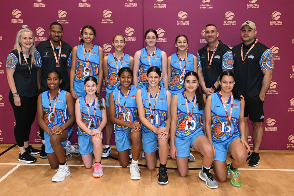 Cairns Basketball under-14 girls’ team. Back row (from left) manager Katie Dorahy, development coach Curt Ah Wang, players Brienne Long, Americus Walker, Clare Zuvelek, Mikaylee Martin, coach Callum Whiteside and assistant coach Aaron Luki. Front row (from left), Nancy George, Skye Dorahy, Evelyn Pearson-Pitt, Summer Mitchley, Karesse Luki and Grace McGoogan. Picture: Basketball Queensland