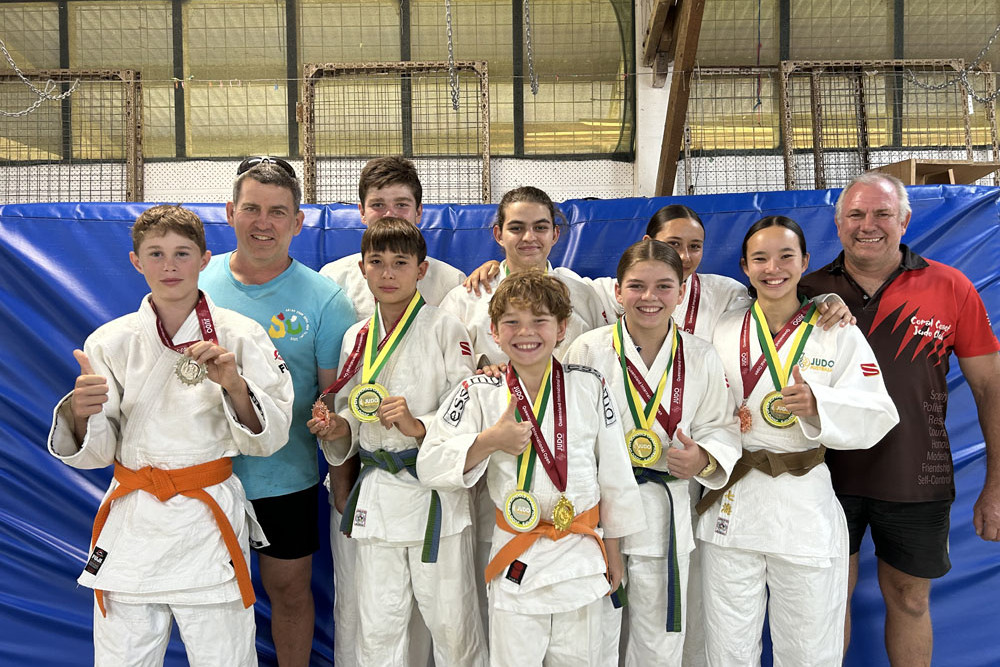 Mitchell Carbis (left), coach Andy Smith, Max Schmidt (back), Rikki Anderson (front), Nikita McDonald, Julie Anderson, Lillian Schmidt, Nanami Anderson, coach Jeffrey Anderson and Harrison Smith (front centre). Picture: Supplied