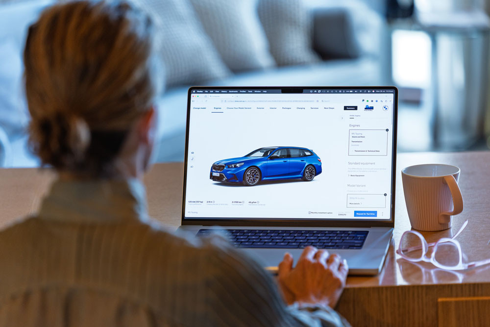 A customer selects the paint hues for her new BMW M5 Touring. Picture: BMW Australia
