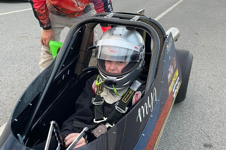 Daniel Bath encourages young racer Shmya Lelli at Springmount Raceway. Picture: Supplied