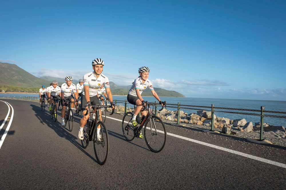 Gran Fondo cyclists on the iconic Captain Cook Highway between Cairns and Port Douglas. Picture: Port Douglas Gran Fondo